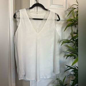 NWOT Sleeveless v-neck blouse with lace details